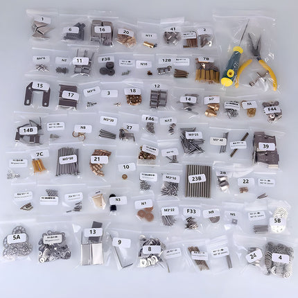  A comprehensive collection of organized metal model parts and tools for a 3D puzzle metal kit, including screws, nuts, plates, and specialized components. Perfect for building a complex mechanical steampunk creation.
