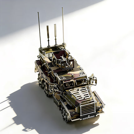 A front high-angle view of a completed camo 6x6 tactical armored vehicle metal puzzle with open cabin doors, showcasing its realistic military camouflage plating, defense turret, and steel wheels with deep shadows on a white background.