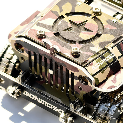 A macro close-up of the camouflage hood and front grille of a camo willys jeep metal puzzle, highlighting the engraved military star insignia, bumper lettering, and screw joints on a white background.