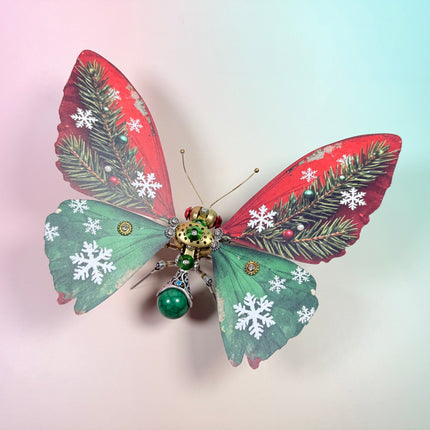 Intricate steampunk puzzle butterfly featuring festive colors and snowflake accents, premium metal model for holiday desktop decoration.
