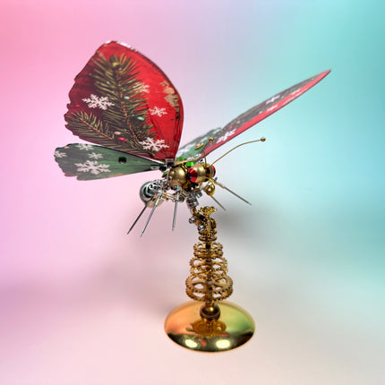 Holiday themed 3D puzzle Metal Kit featuring a mechanical butterfly with snowflake wings, a challenging steampunk puzzle gift.