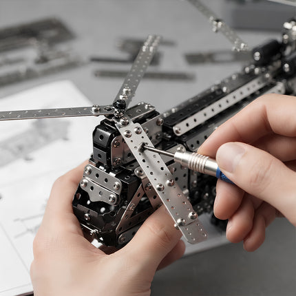 Detailed shot of tightening tiny screws on a metallic aircraft puzzle kit with precision mini tools.