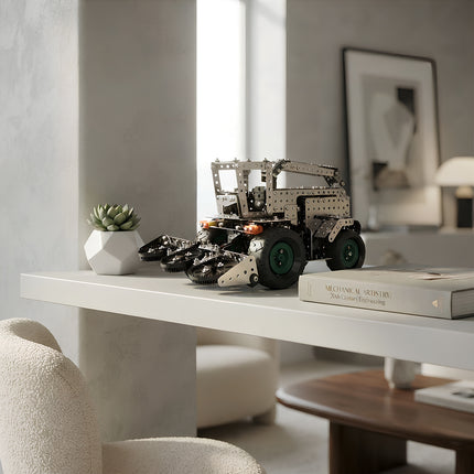 Assembled DIY metallic combine harvester mechanical model puzzle showcased as an elegant office or home interior desktop ornament.