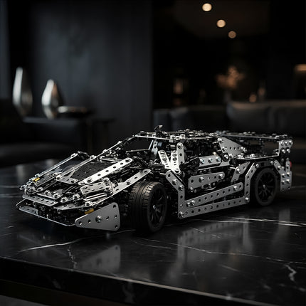 Sleek metallic race car building kit model showcasing intricate mechanical details as a premium home desk ornament.