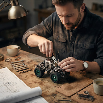 Adult mechanic enthusiast hands-on building a metallic 3D tractor puzzle model kit with precision tools and blueprints.