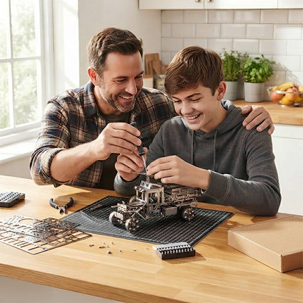 Teenager and parent building an intricate metallic truck model using hand tools as an engaging STEM family project.