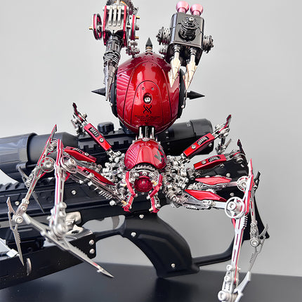 A complex red and silver mechanical spider metal model, featuring intricate mechanical steampunk details and weaponry, displayed on a firearm. This unique steampunk mech is an impressive steampunk puzzle.
