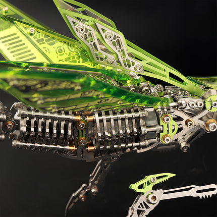 Close-up of translucent green acrylic wings and the stainless steel abdomen structure of a **3D metal puzzle** mantis.