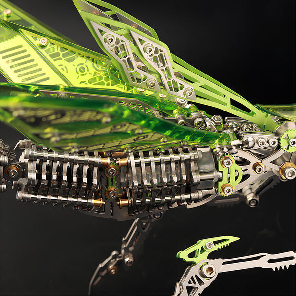 Close-up of translucent green acrylic wings and the stainless steel abdomen structure of a **3D metal puzzle** mantis.