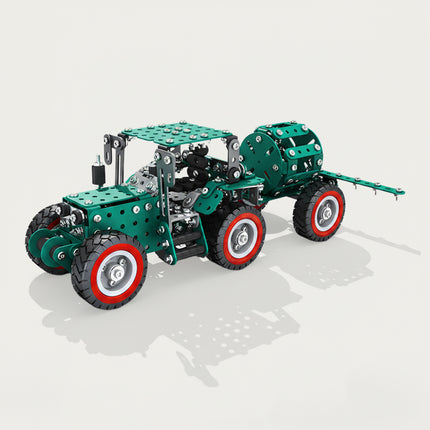 A 3D render of a green mechanical tractor metal model kit with an attached rear trailer drum, featuring four wheels on the main tractor and red-rimmed tires.