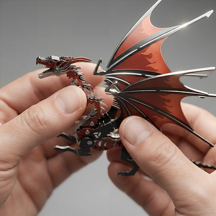 Close-up shot of hands fine-tuning the intricate metallic head and wings of a red and black 3D metal mechanical dragon model.