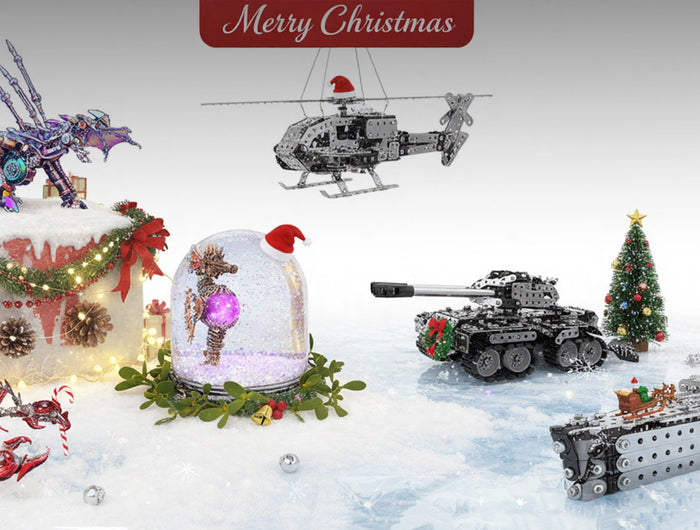 A festive "Merry Christmas" display featuring a variety of DIY metal model kits, including a dragon, scorpion, helicopter, tank, and battleship, all set in a snowy scene with holiday decorations. These detailed 3D puzzle creations make funny table gifts for the holiday season.