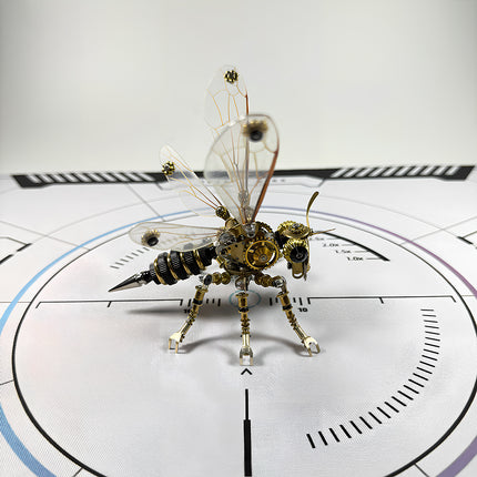 A collectible DIY steampunk puzzle of a robotic bee, an exquisite metal model on a technical calibration mat from TableFunny.