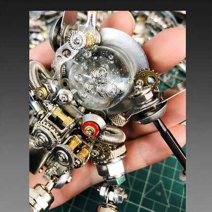 Hands-on crafting view of a mechanical steampunk puzzle astronaut helmet and chest assembly featuring polished metallic parts.