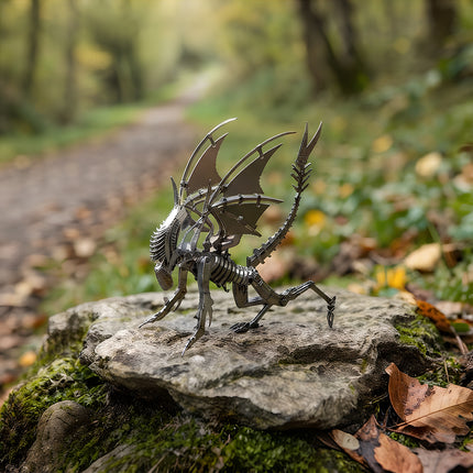 Outdoor nature photography of a mechanical steampunk puzzle creature figure showcasing organic metallic armor and wings.