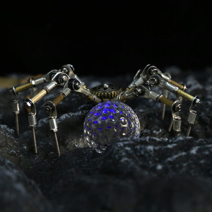 A futuristic mechanical steampunk spider protecting a glowing blue orb on a rocky terrain, a highly detailed metal model for collectors.
