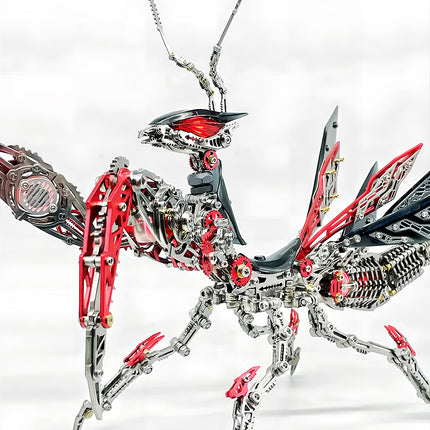 A full view of an intricately designed metal praying mantis model, with striking silver and red components, standing in an alert pose. This detailed 3d puzzle metal model from metal kits is a captivating piece for any funny table display.