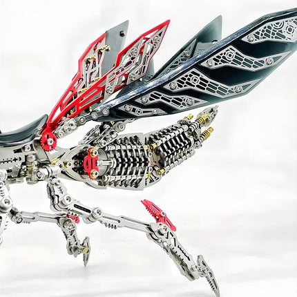 Close-up of the articulated wings and legs of a futuristic metal praying mantis model, showcasing the intricate details of this 3d puzzle and DIY metal model kit. The silver and red components create a striking design.