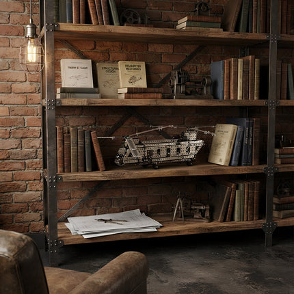 Detailed metallic aircraft puzzle displayed as an architectural and engineering collectible on a rustic bookshelf.