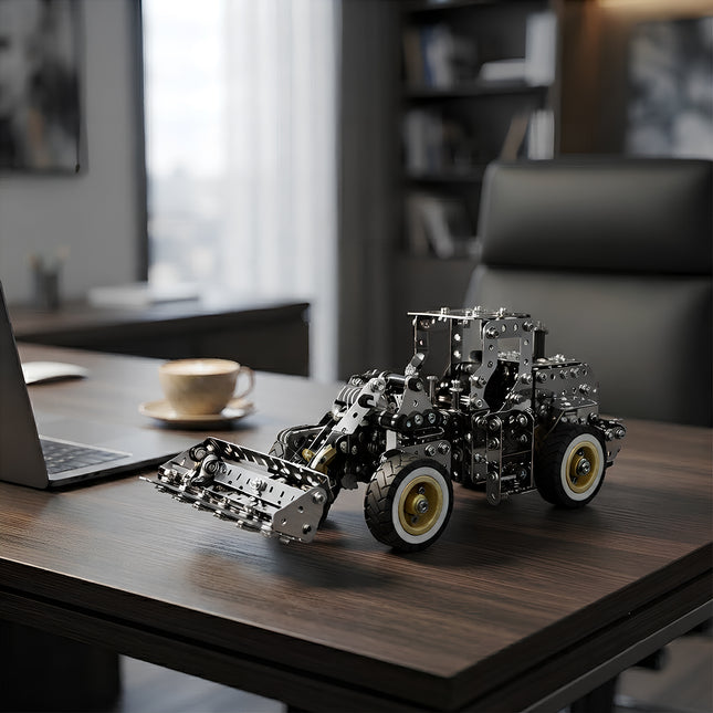 Detailed metallic mechanical wheel loader construction vehicle puzzle as a stylish desk art toy and gift for engineers.
