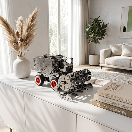Intricate metallic 3D combine harvester mechanical model puzzle as a stylish desk art display in a bright contemporary home.