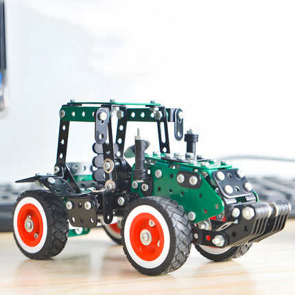 A green modern agricultural vehicle metal model kit displayed on a wooden table, showing a lifestyle setup as unique office desktop decor.