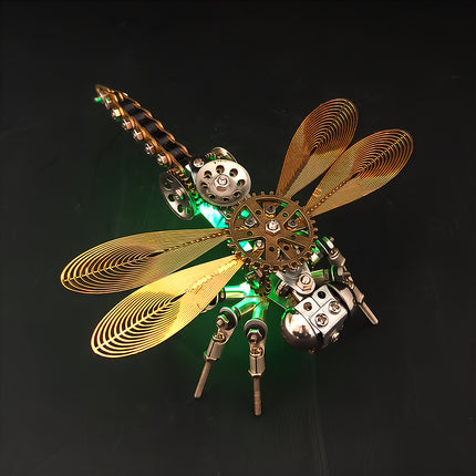Close-up of the illuminated 3D puzzle Metal Kits dragonfly sculpture. Against a dark background, the mechanical steampunk creature’s spiral wings and chained tail shine brightly, establishing this steampunk puzzle as a premier metal model and steam punk mech.