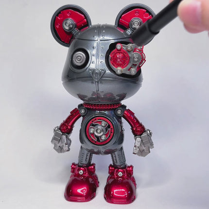 Assembling a unique metal model robot with Mickey Mouse-inspired features, a fun DIY 3D puzzle from our Metal Kits. This collectible metal model adds a funny table accent and showcases intricate design.
