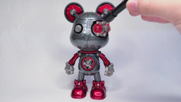 Assembling a unique metal model robot with Mickey Mouse-inspired features, a fun DIY 3D puzzle from our Metal Kits. This collectible metal model adds a funny table accent and showcases intricate design.