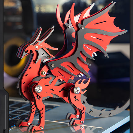 Side view of the red and black mechanical dragon steampunk puzzle 3D metal model on a laptop.