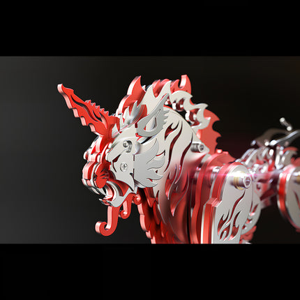 Close-up view of the red and silver mechanical beast model Tianwu, highlighting the metallic unicorn horn and laser-cut flame patterns.