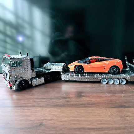 A semi-trailer tractor metal model carrying an orange sports car, built from 3D puzzle Metal Kits as an amazing steampunk puzzle steam punk mech vehicle.