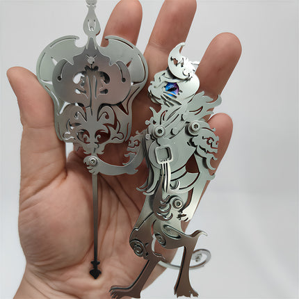 Size reference of silver steam punk mech metal model held in hand.
