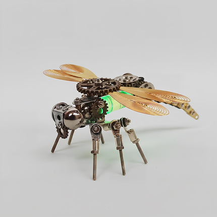A detailed view of the steampunk puzzle dragonfly model, emphasizing its unique glowing green thorax and metallic spiral wings. This high-quality steam punk mech is constructed from precision metal parts, gears, and bolts, capturing the essence of mechanical steampunk design.