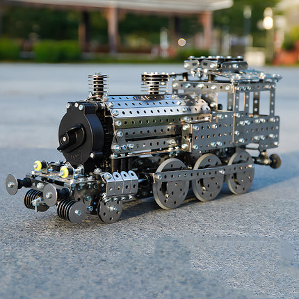 A mechanical steampunk train locomotive metal model displayed on a premium wooden base outdoors