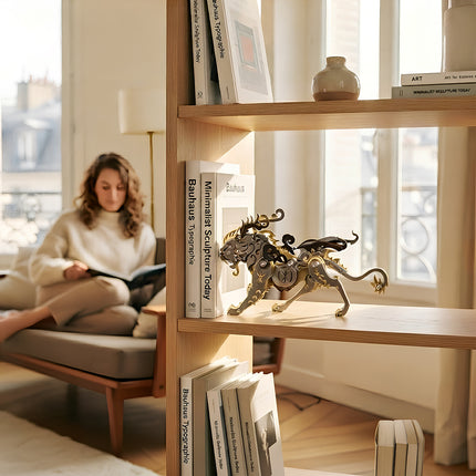 An elegant mechanical steampunk mythical beast metal model on a wooden bookshelf, a unique steampunk puzzle and 3D puzzle Metal Kit for home decor.