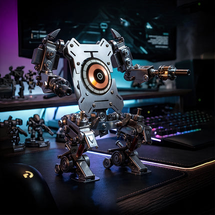 Assembled Tablefunny steampunk puzzle mech model placed on a gaming desk with keyboard and monitor, highlighting cool cyberpunk vibes for 3D puzzle Metal Kits.