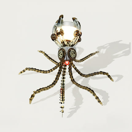 A top-view product shot of a steampunk puzzle octopus model featuring a brightly illuminated spherical head framed by mechanical arches, gears, and spreading chain-link tentacles. Built from 3D puzzle Metal Kits, this metal model showcases an exceptional mechanical steampunk and steam punk mech design.