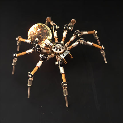 A dramatic night-view photograph of the steampunk puzzle spider model against a dark background, highlighting a warm golden glowing spherical abdomen. This exquisite metal model built from precision 3D puzzle Metal Kits showcases intricate multi-jointed metallic legs and a fascinating mechanical steampunk 