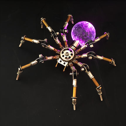A dramatic night photograph of the steampunk puzzle spider model against a dark background, highlighting a vibrant purple glowing spherical abdomen. This exquisite metal model crafted from 3D puzzle Metal Kits features multi-jointed metallic legs and a brilliant mechanical steampunk / steam punk mech design.