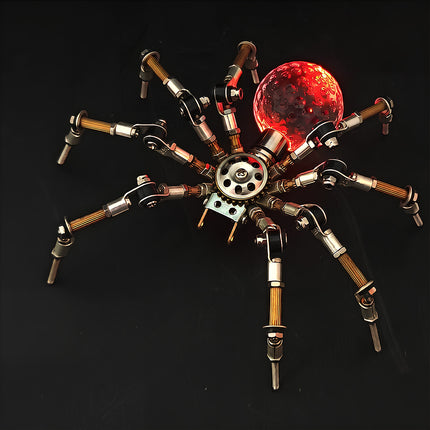A dramatic night-view photograph of the steampunk puzzle spider model against a dark background, featuring a vibrant red glowing spherical abdomen. This exquisite metal model built from precision 3D puzzle Metal Kits showcases intricate multi-jointed legs and a fascinating mechanical steampunk / steam punk mech aesthetic.
