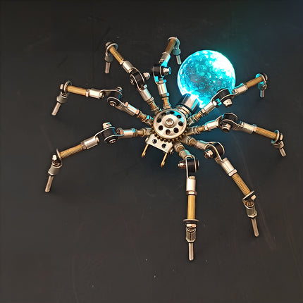 A dramatic night-view photograph of the steampunk puzzle spider model against a dark background, highlighting a brilliant turquoise glowing spherical abdomen. This exquisite metal model built from precision 3D puzzle Metal Kits showcases intricate multi-jointed metallic legs and a fascinating mechanical steampunk aesthetic.