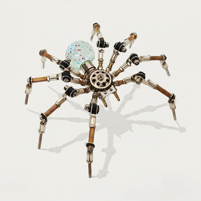 A front-angle product shot of the steampunk puzzle spider model against a clean white background, showcasing its rainbow-shifting and speckled translucent spherical abdomen. This creative metal model built from 3D puzzle Metal Kits features multi-jointed metallic legs and an intricate mechanical steampunk mech design.