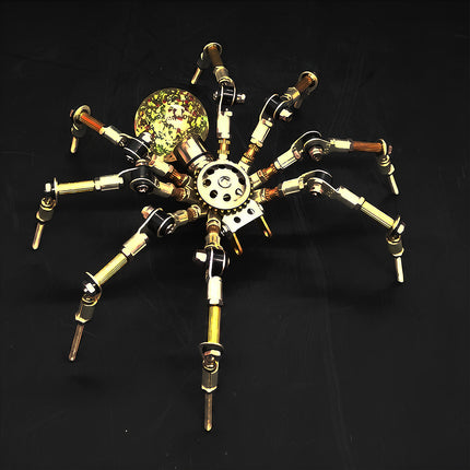A top-down view of the steampunk puzzle spider model against a dark backdrop, emphasizing its unique translucent spherical abdomen filled with colorful speckles. This striking metal model crafted from 3D puzzle Metal Kits showcases intricate mechanical joints and a brilliant mechanical steampunk / steam punk mech design.