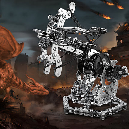 A silver mechanical ballista metal model by TableFunny, dramatically set against a fantasy battle background with a dragon. This complex mechanical steampunk toy highlights the adventurous building experience of our 3D puzzle Metal Kits.