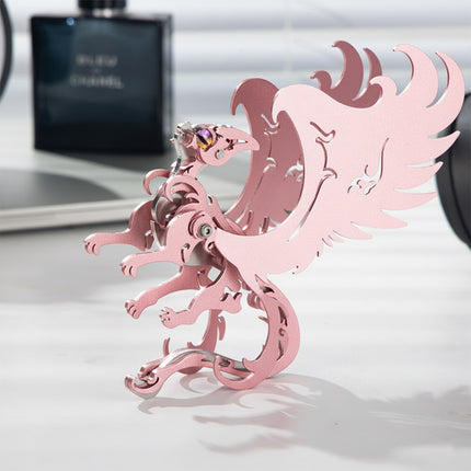 A close-up side view of the finished pink mythical cat princess metal model by TableFunny. This elegant steampunk puzzle features a distinctive mechanical steampunk structure, perfect for a modern office setup.