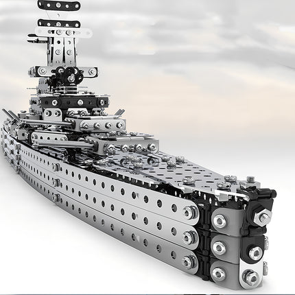 A stunning close-up front view of the silver battleship metal model by TableFunny. This mechanical steampunk warship model showcases intricate building blocks and layers from our 3D puzzle Metal Kits.