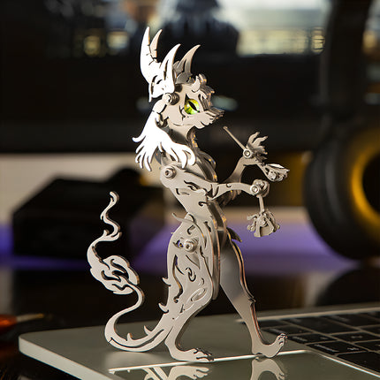 Side profile view of silver creature steam punk mech metal model on tech desk