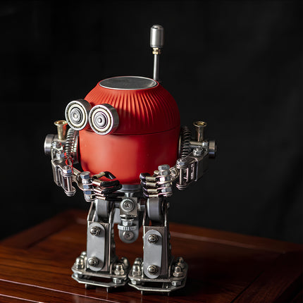 Premium collectible steam punk mech metal model with red body and detailed mechanical parts, displayed on a dark wooden base.