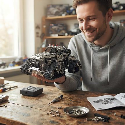 A proud hobbyist holding up a completed steam punk mech metal tracked vehicle model in his workshop, showcasing the finished DIY build.